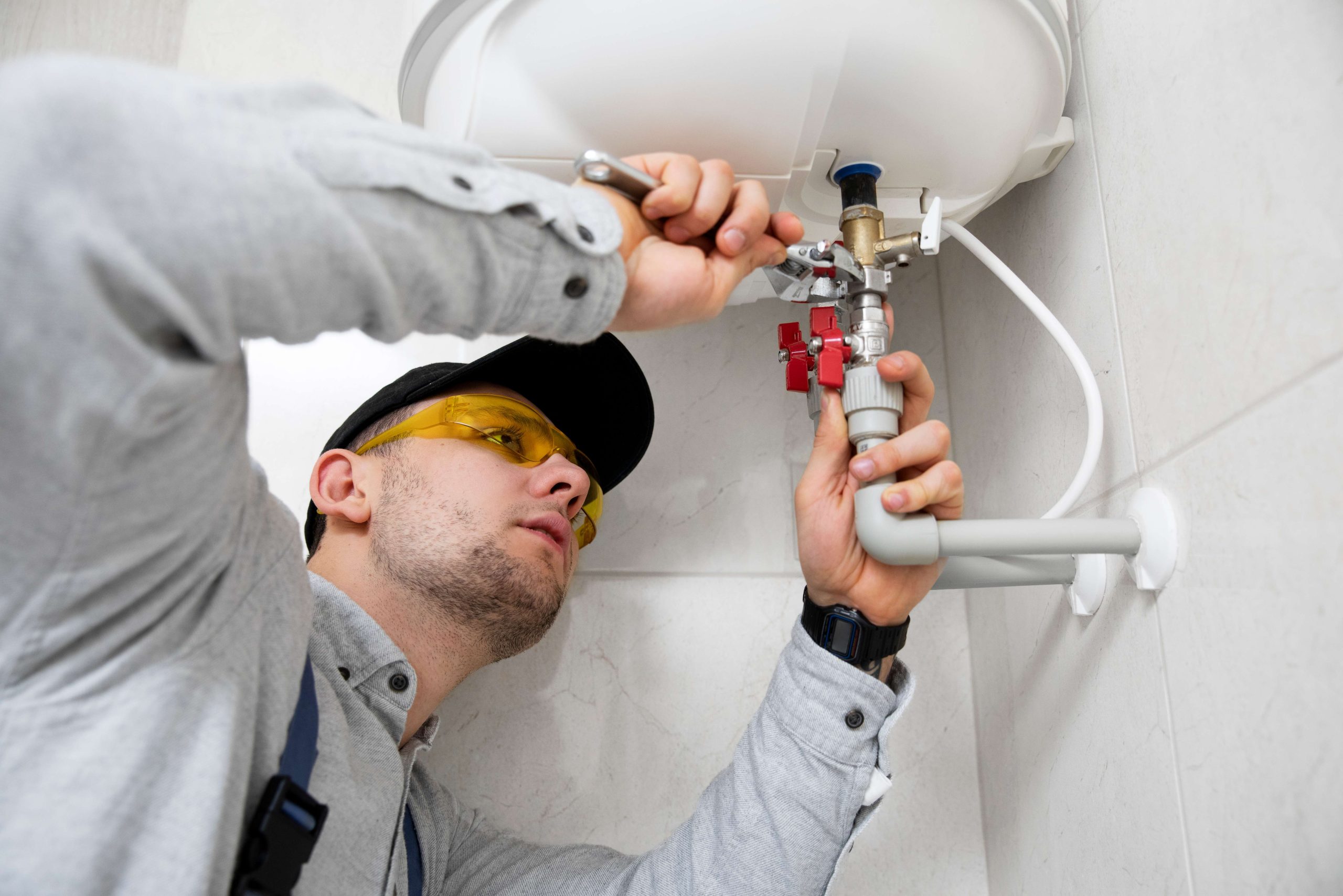 worker-repairing-water-heater-1-11zon